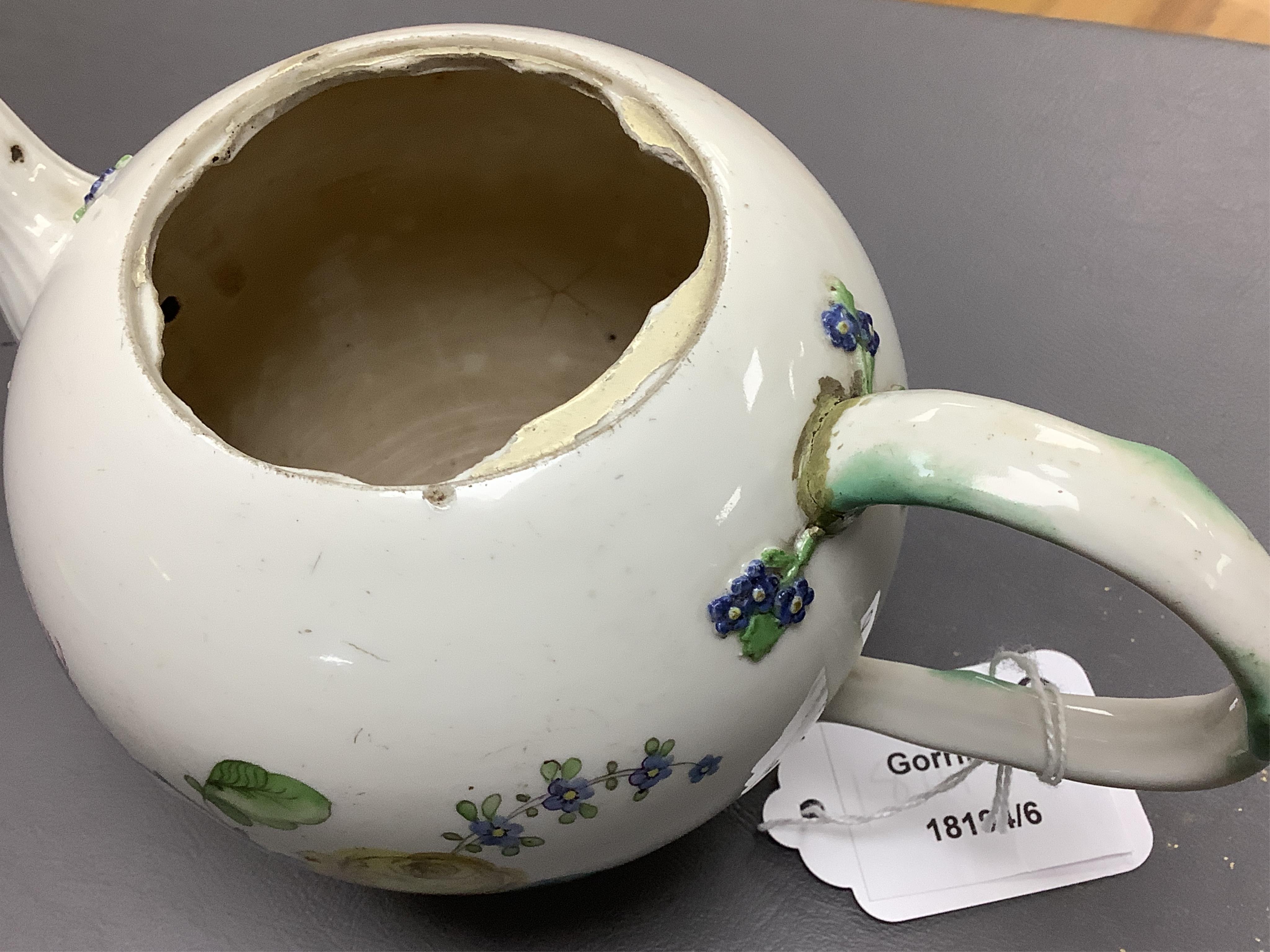 The Hague, a late 18th century soft paste porcelain teapot, painted with polychrome flowers, 12cm high